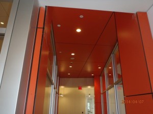 Trespa orange panel hallway